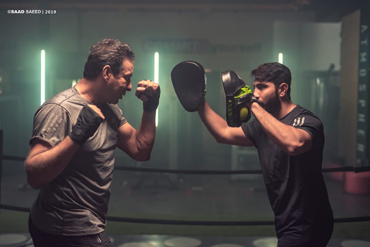 Waseem Akram Reviewing Fitness Metrics with Celebrity Trainer Muhammad Rabeet Khan at FitVerse